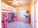 Bedroom with ceiling fan, bed with curtain, painting and telescope at 6415 W Escuda Rd, Glendale, AZ 85308