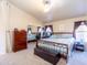 Spacious bedroom with carpeting, vaulted ceiling and large window at 6415 W Escuda Rd, Glendale, AZ 85308