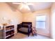 Cozy bedroom with carpet, ceiling fan, and crib at 6415 W Escuda Rd, Glendale, AZ 85308