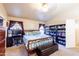 Spacious bedroom with carpeting, vaulted ceiling and large window at 6415 W Escuda Rd, Glendale, AZ 85308