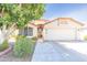 Charming single-story home features a well-maintained front yard and a two-car garage at 6415 W Escuda Rd, Glendale, AZ 85308
