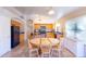 Bright eat-in kitchen features black appliances, wood cabinets and tile floors at 6415 W Escuda Rd, Glendale, AZ 85308
