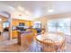 Eat-in kitchen features modern appliances, an island, and tile countertops and flooring at 6415 W Escuda Rd, Glendale, AZ 85308