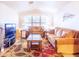 Bright living room featuring tile flooring and a large window for ample natural light at 6415 W Escuda Rd, Glendale, AZ 85308