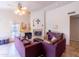 Features a ceiling fan, fireplace, tile flooring, and natural light at 6415 W Escuda Rd, Glendale, AZ 85308