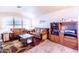 Cozy living room with tile flooring and a large window for natural light at 6415 W Escuda Rd, Glendale, AZ 85308