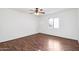 Bright bedroom featuring hardwood floors and a ceiling fan at 9641 N 36Th Dr, Phoenix, AZ 85051