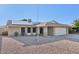 Exterior view of home featuring solar panels, brick accents, and low-maintenance landscaping at 9641 N 36Th Dr, Phoenix, AZ 85051