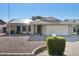 Home featuring solar panels, brick accents, a driveway, and low-maintenance landscaping at 9641 N 36Th Dr, Phoenix, AZ 85051
