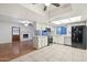 Bright kitchen featuring an island, white cabinets, stainless steel appliances, and tile flooring at 9641 N 36Th Dr, Phoenix, AZ 85051