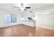 Open-concept living area with hardwood floors and seamless flow into the breakfast bar at 9641 N 36Th Dr, Phoenix, AZ 85051