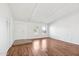 Bright living room featuring hardwood floors, bright windows, and entry door at 9641 N 36Th Dr, Phoenix, AZ 85051