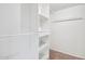 Bright walk-in closet with built in shelving at 9641 N 36Th Dr, Phoenix, AZ 85051