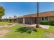 Back exterior view of backyard showcasing patio and partial landscaping at 10022 W Mountain View Rd, Sun City, AZ 85351