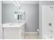 A refreshed bathroom with double sinks, a large mirror, and shower at 10022 W Mountain View Rd, Sun City, AZ 85351