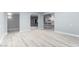 Open-concept layout showcasing the new flooring and seamless flow between living spaces at 10022 W Mountain View Rd, Sun City, AZ 85351