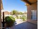 Backyard view showcasing beautiful desert landscaping, patio area, and lush greenery at 11103 E Blue Sky Dr, Scottsdale, AZ 85262