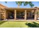 Inviting backyard patio with a covered seating area and well maintained landscaping at 11103 E Blue Sky Dr, Scottsdale, AZ 85262