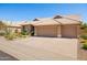 Charming single-story home featuring a desert-landscaped yard and a spacious three-car garage at 11103 E Blue Sky Dr, Scottsdale, AZ 85262