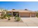 Charming single-story home with a well-manicured desert landscape and a three-car garage at 11103 E Blue Sky Dr, Scottsdale, AZ 85262