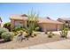 Charming home with desert landscaping, tile roof, and a three-car garage at 11103 E Blue Sky Dr, Scottsdale, AZ 85262