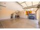 Spacious three-car garage with epoxy flooring, built-in cabinets, and ample storage space at 11103 E Blue Sky Dr, Scottsdale, AZ 85262