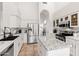 Bright, updated kitchen with white cabinets, granite countertops, stainless steel appliances, and tiled floor at 11103 E Blue Sky Dr, Scottsdale, AZ 85262