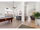 Bright living space with a pool table, and views of the backyard at 11103 E Blue Sky Dr, Scottsdale, AZ 85262