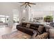 Open-concept living space with a plush sectional, decorative rug, and easy access to the kitchen at 11103 E Blue Sky Dr, Scottsdale, AZ 85262