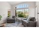 Cozy seating area with a large window offering natural light and outdoor views at 11103 E Blue Sky Dr, Scottsdale, AZ 85262