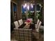 Elegant dining room with stylish chandelier and views of the backyard oasis at 11320 E Winchcomb Dr, Scottsdale, AZ 85255