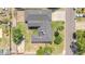 Overhead view of the home's roof and backyard layout including lawn, trees, and fences at 1208 E Tuckey Ln, Phoenix, AZ 85014
