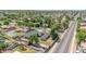 Aerial view of home with a swimming pool, large trees, and spacious yard at 1208 E Tuckey Ln, Phoenix, AZ 85014