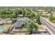 Elevated shot of the home showcasing the surrounding neighborhood, mature trees, and community streets at 1208 E Tuckey Ln, Phoenix, AZ 85014