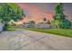 Spacious backyard showcasing mature trees, a patio area, and lush lawn perfect for entertaining at 1208 E Tuckey Ln, Phoenix, AZ 85014
