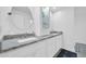 Modern bathroom with double sinks, granite countertops, and ample storage space at 1208 E Tuckey Ln, Phoenix, AZ 85014