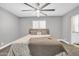 Cozy bedroom with neutral paint, carpet floors, and a ceiling fan at 1208 E Tuckey Ln, Phoenix, AZ 85014