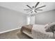 Comfortable bedroom with neutral paint, carpet floors, and a ceiling fan at 1208 E Tuckey Ln, Phoenix, AZ 85014
