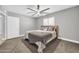 Comfortable bedroom featuring a ceiling fan and natural light from a window at 1208 E Tuckey Ln, Phoenix, AZ 85014