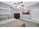 Bedroom with wall-mounted TV, floating shelves, and a spacious dresser at 1208 E Tuckey Ln, Phoenix, AZ 85014