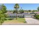 Charming one-story home featuring a well-manicured lawn and a classic water fountain feature at 1208 E Tuckey Ln, Phoenix, AZ 85014
