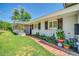 Charming single-story home with a welcoming front entrance and well manicured landscaping at 1208 E Tuckey Ln, Phoenix, AZ 85014