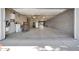 Bright, open garage with concrete floors, water heater, and ample lighting at 1208 E Tuckey Ln, Phoenix, AZ 85014