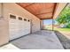 Attached garage features a covered parking area and access to a grassy backyard at 1208 E Tuckey Ln, Phoenix, AZ 85014