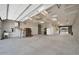 Spacious garage with concrete floors, ample lighting, and tall ceilings at 1208 E Tuckey Ln, Phoenix, AZ 85014