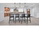 Bright, open kitchen with a large island, modern pendant lighting, and stainless steel appliances at 1208 E Tuckey Ln, Phoenix, AZ 85014