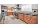 Well-equipped kitchen with stainless steel appliances, shaker cabinets, and a functional layout at 1208 E Tuckey Ln, Phoenix, AZ 85014