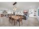 Open-concept living space featuring a dining area, fireplace, and modern kitchen with an island at 1208 E Tuckey Ln, Phoenix, AZ 85014