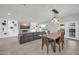 Spacious living room with an open layout, connecting the living area, dining space, and outdoor patio at 1208 E Tuckey Ln, Phoenix, AZ 85014