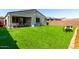 Expansive backyard featuring lush, green artificial turf perfect for recreation and relaxation at 12204 W Parkway Ln, Avondale, AZ 85323